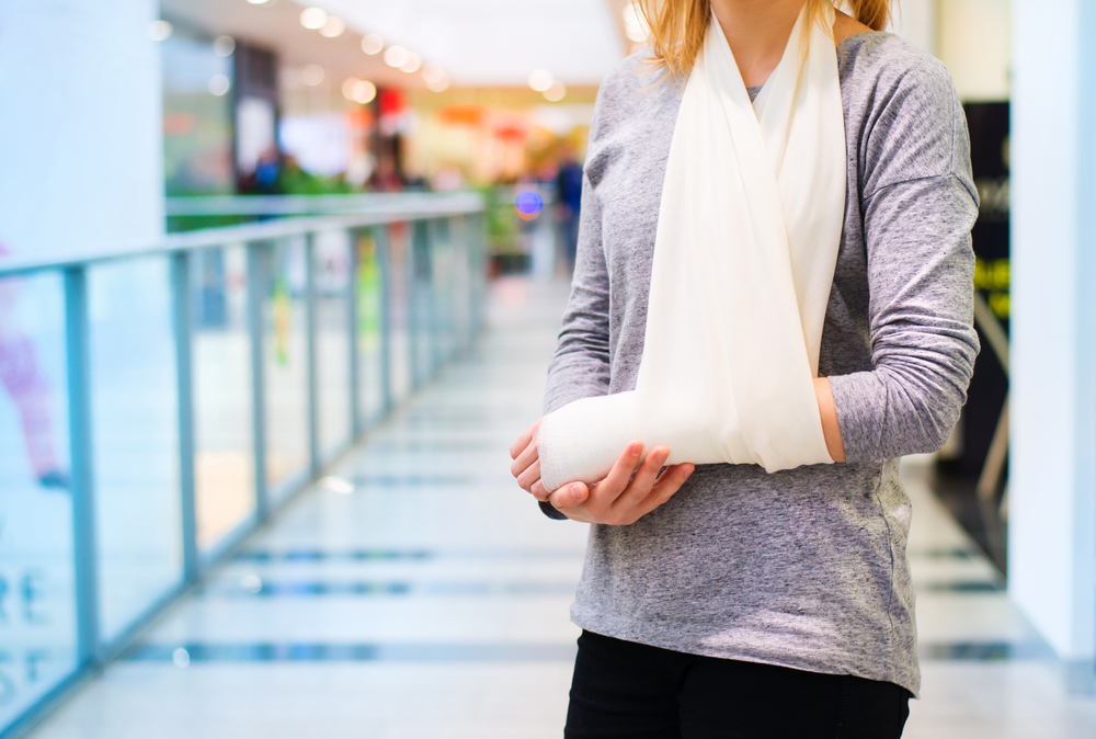 Woman with broken arm after being injured at a shopping centre