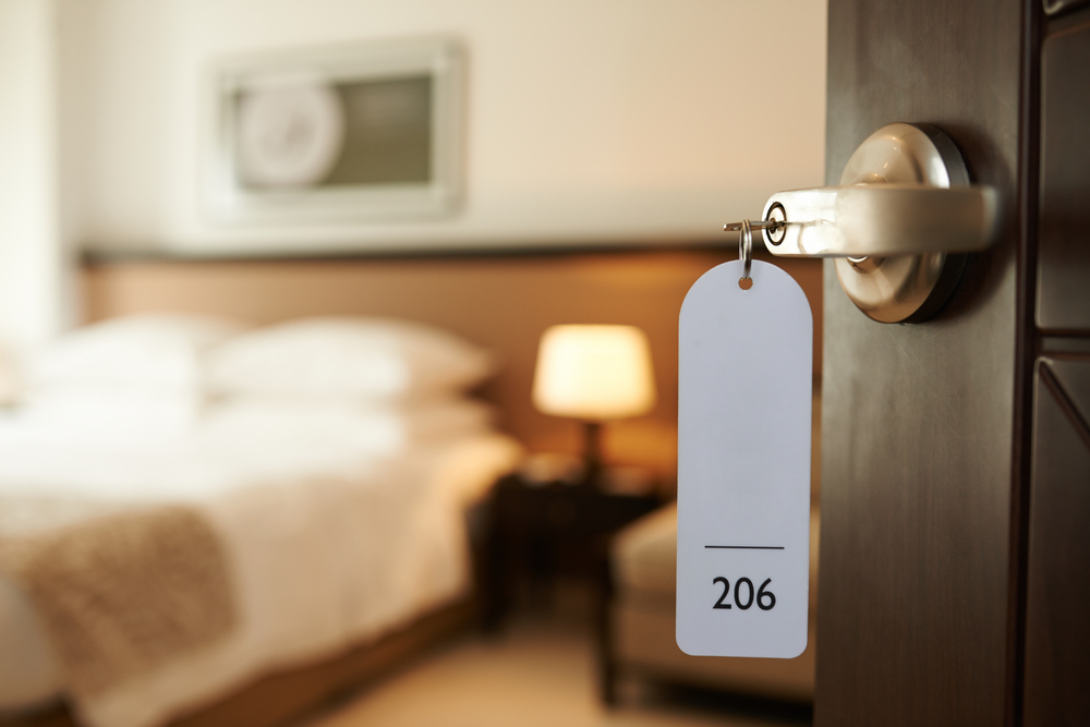 Photograph of hotel room 206 with door slightly ajar