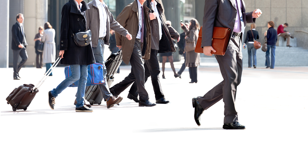 Photograph of pedestrians walking in public space during winter