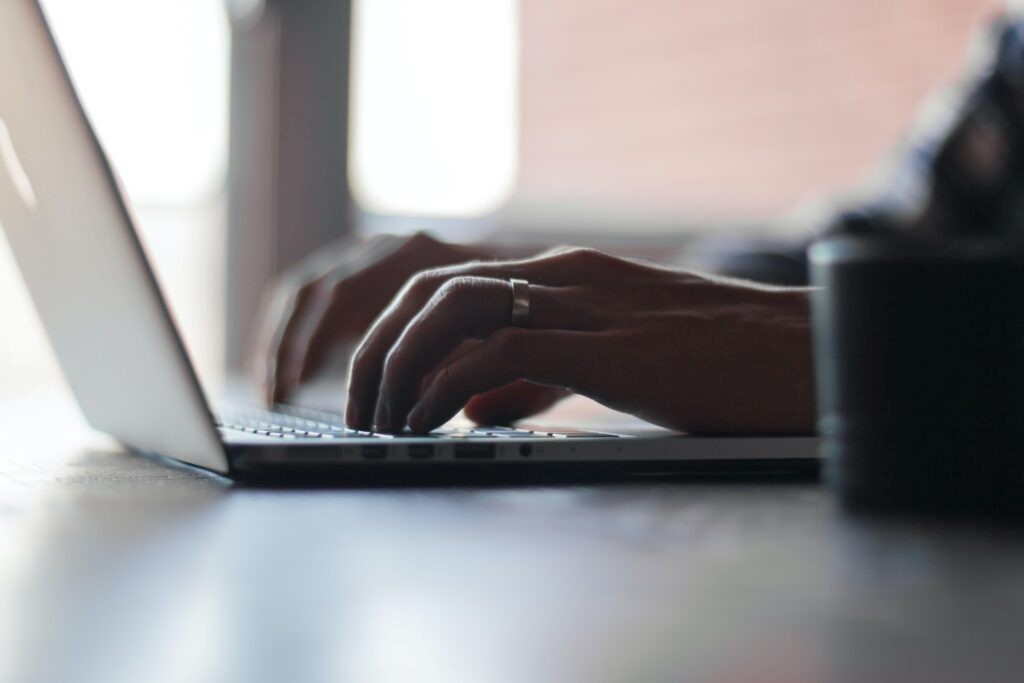 A person working on a Macbook laptop 