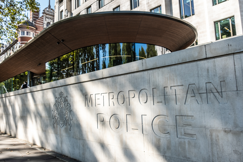 picture of metropolitan police sign outside Scotland Yard for actions against the police case study.