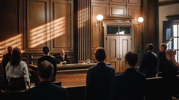 Image of the inside of a courtroom with a trial ongoing 