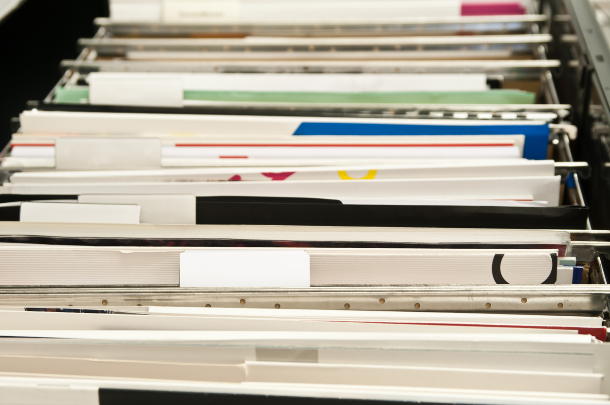 A picture of a filing cabinet draw full of records