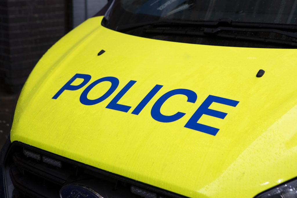 Close-up of a yellow police van