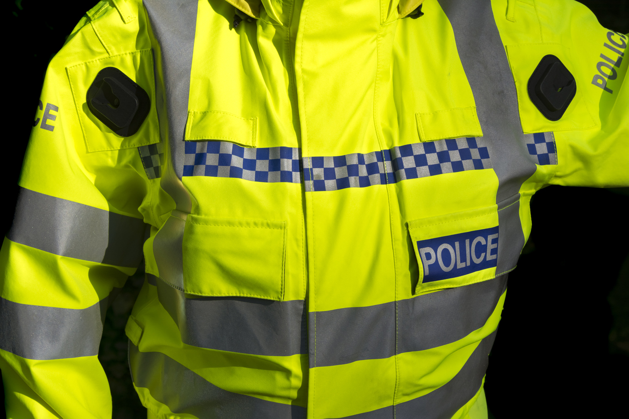 Picture of a police officer wearing a Police reflective jacket