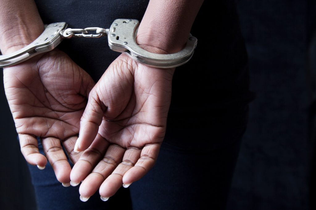 Close up of a persons palms while handcuffed