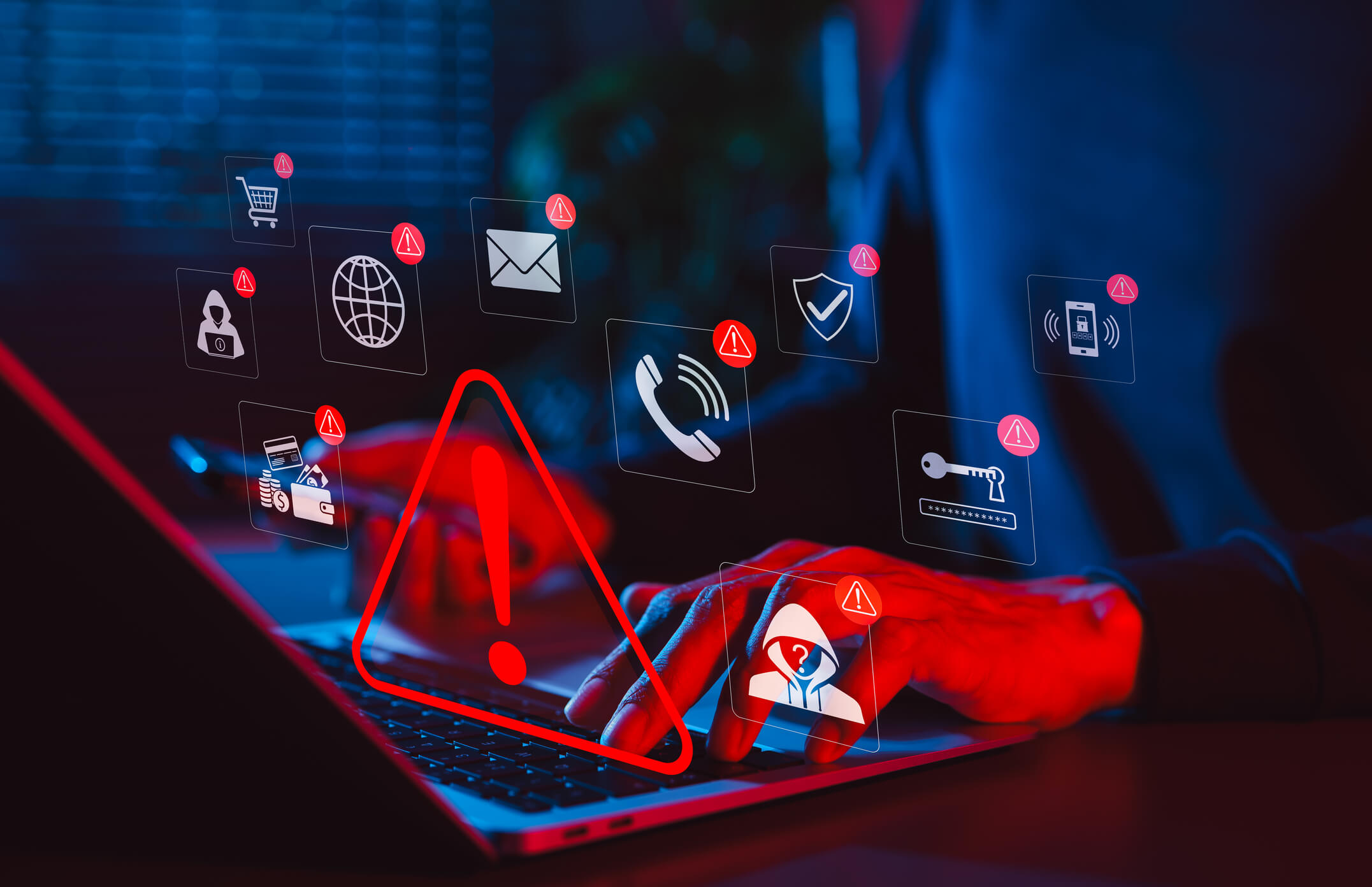 Online scam alert and cybersecurity warning concept. Man holding phone while using laptop, warning sign for scam with icons online threats, phishing, cyber secure, unknown person, suspicious scammer